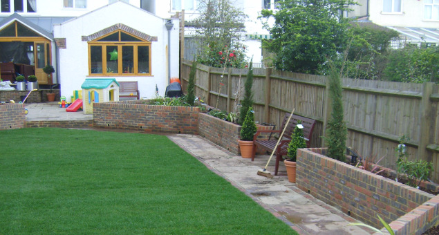 The raised beds served to disguise the retaining wall to next door. 