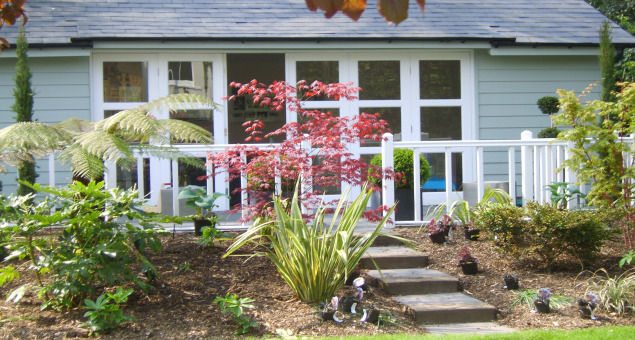 We created a second seating area outside the new outdoor room at the end of the garden.