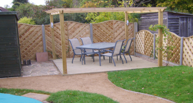 One of the old sheds at the bottom of the garden was taken away and in its place we constructed a deck area and pergola with scented climbers, giving our clients another place to sit and get a different view of the garden. The other existing shed was hidden by planting large bamboos. 
