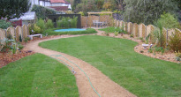 image of a family garden with a sunken trampoline