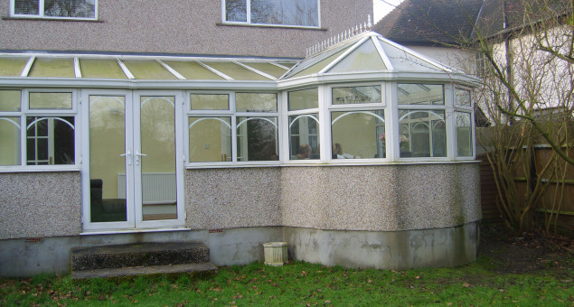 A conservatory had been built to one side in which our clients felt overlooked from both sides and which had caused some problems with drainage in the garden. There was also a large drop to the lawn level from the house which our clients weren’t sure how to deal with.