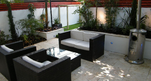 Beautiful Travertine stone was chosen for the patio and steps for its clean, elegant lines and to complement the existing garden furniture. 