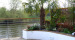 The dining area was surrounded by rendered raised beds with exotic planting in bright colours against a backdrop of natural willow screens.