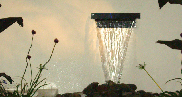 The contemporary steel water feature is an imposing focal point and adds the exciting dimension of sound. 