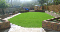 image of long thin family garden with play area for children at the end