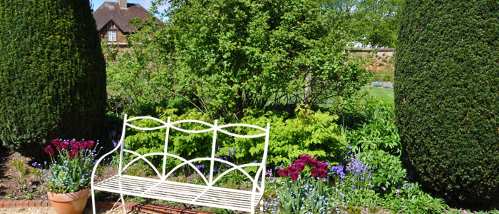 A professionally cut hedge at a garden in Sussex