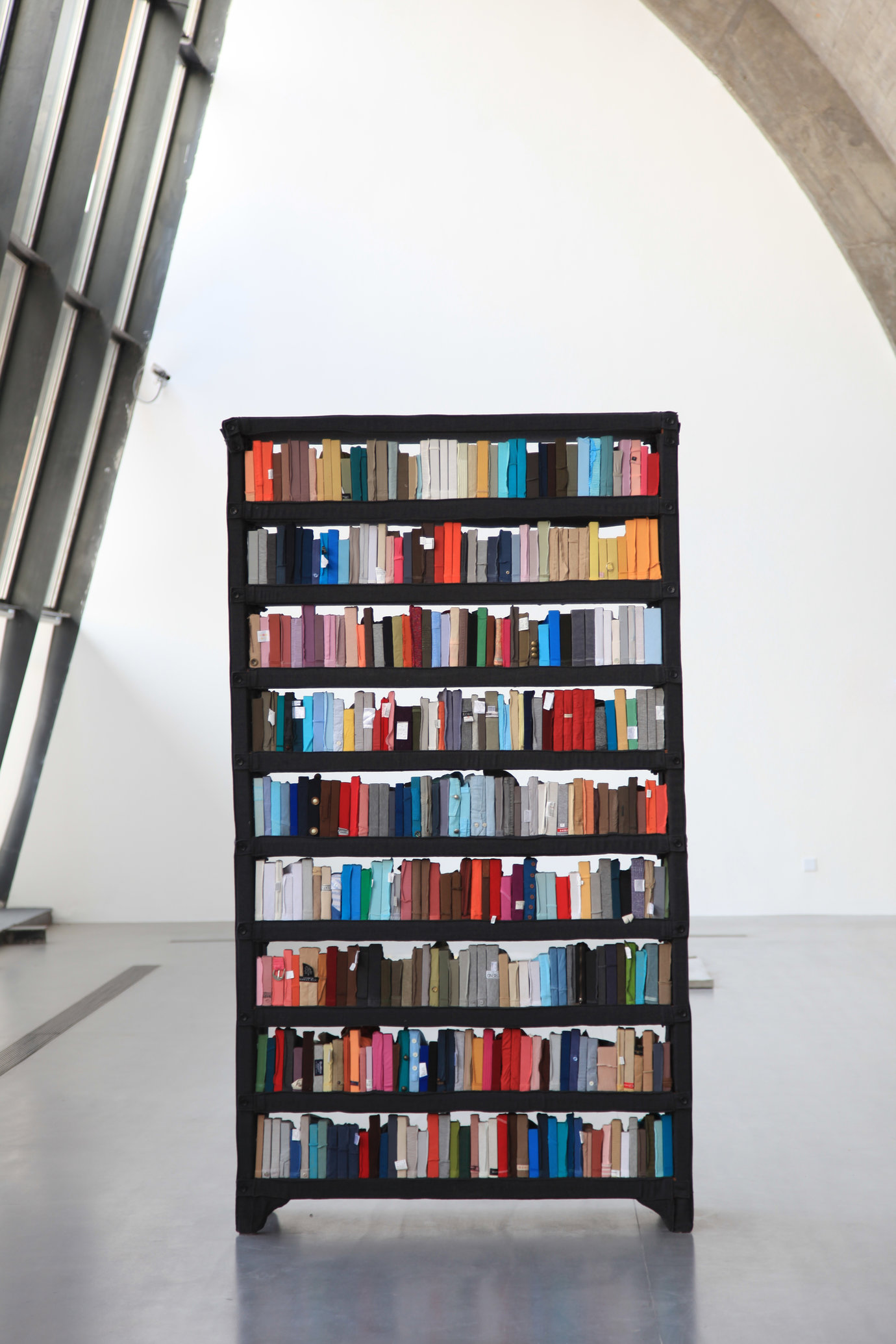 . Clothes, wood, and bookshelf, 226 x 126 x 43 cm.