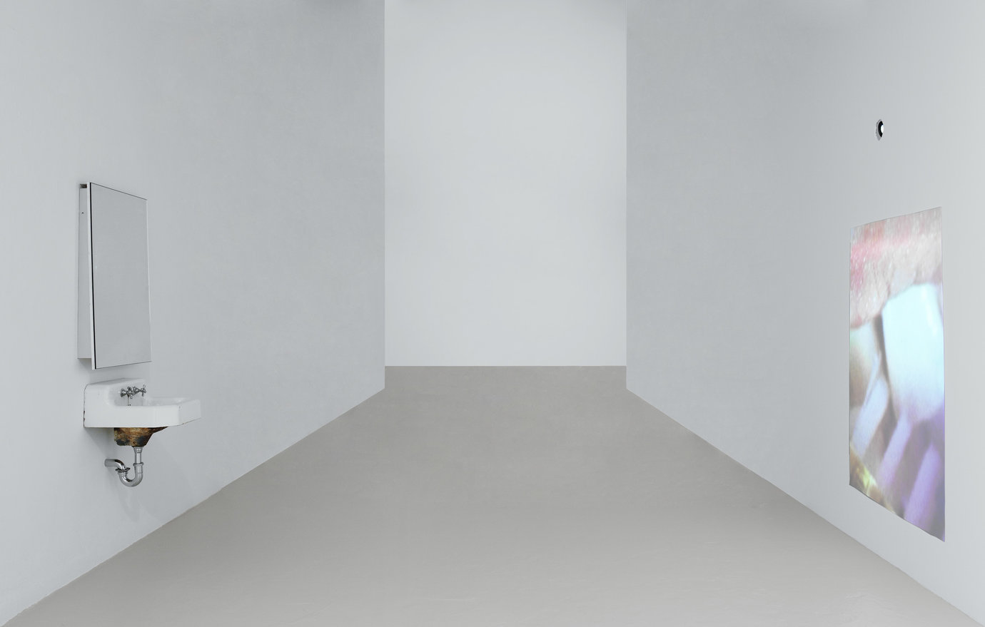 , 1964. Dvd, bathroom sink, and mirror, installation dimensions variable
video loop: 14 minutes, 3 seconds.