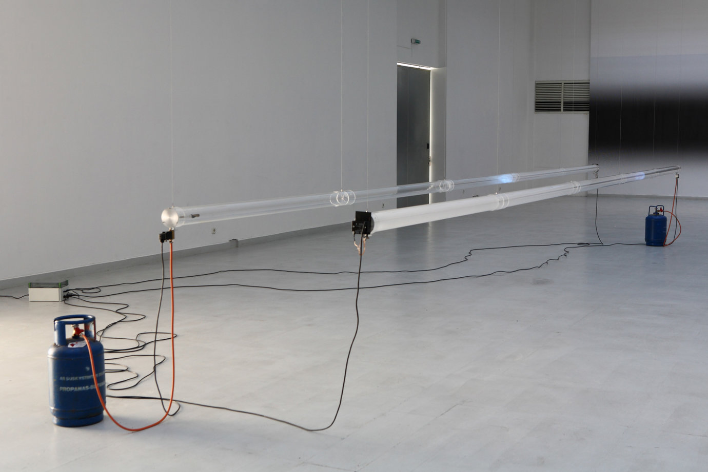 , 2007. Perspex tubes, gas, igniting mechanism, installation dimensions variable, site specific.