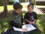 Reading buddies on the SHAS front lawn