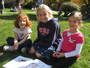 Reading buddies on the SHAS front lawn