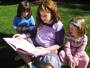 Reading buddies on the SHAS front lawn