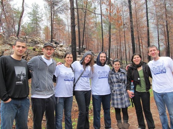 Taking Refuge From Hail Under a Burned Tree in the Carmel Forest
