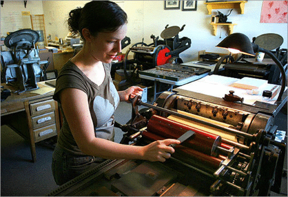 Shelley Barandes operates one of her printing presses
