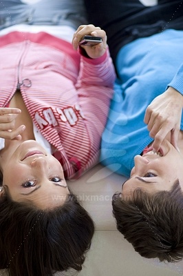 Two Young Women Lying on Sofa picture