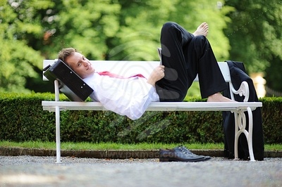 Young Businessman Lying in the Park picture