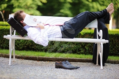 Young Businessman Lying in the Park