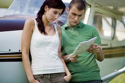 Young Couple by the Aircraft picture
