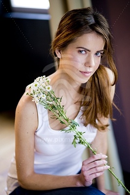 Young Woman Holding Flowerфотография
