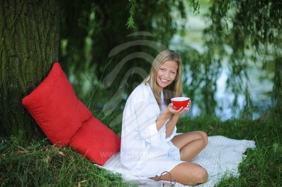 Young Woman Holding Red Cup picture