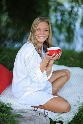 Young Woman Holding Red Cup picture