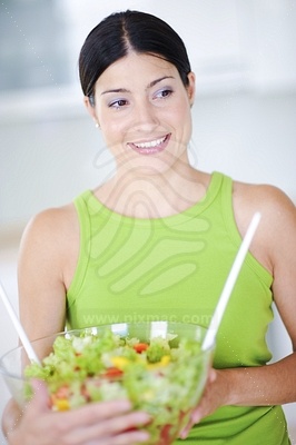 Young Woman in Kitchenфотография
