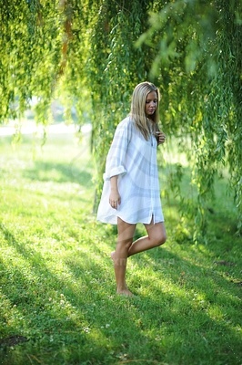 Young Woman in Large White Shirtфотография