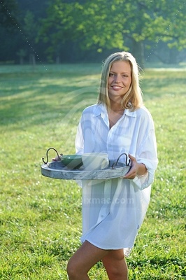 Young Woman in Shirt Holding Platterфотография