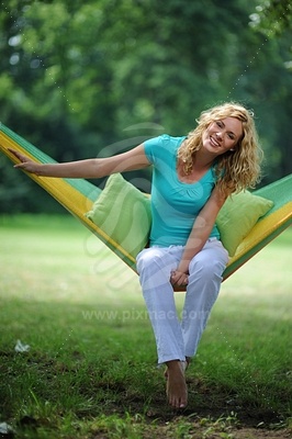 Young woman sitting in hammock picture