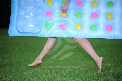 Young Woman with Blue Pool Raft picture