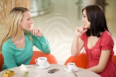 Young Women at Cafeфотография
