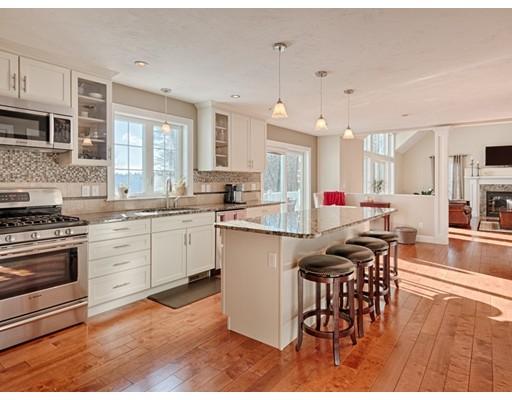 Motivated seller! Thoughtfully laid-out Energy Star home on nearly 8 acres, set off a quiet street offering privacy and spectacular backyard views. Open floor plan makes entertaining a breeze, with kitchen & dining room leading to a beautiful great room with elegant columns. The great room is the heart of the home, showcasing a granite-surround fireplace, cathedral ceiling, & sliding doors surrounded by a wall of windows leading to a lovely deck overlooking beautiful acres of peaceful, undeveloped land. The kitchen offers sliding doors to the deck & features custom, upgraded cabinets & granite, Bosch stainless appliances & an 8-foot island. The master bedroom with vaulted ceiling & a private loft has a tiled master bath with granite double sinks, tub & oversized, tiled shower. Maple hardwood on first floor & second floor hallway, private office, full-sized laundry room & full walk-out basement complete the package. Numerous builder-upgraded features -- better than new! Welcome home!