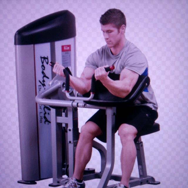 Bicep Curl Machine Exercise Howto Workout Trainer by Skimble