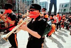 Caption: The Infernal Noise Brigade in downtown Seattle., Credit: http://www.andrewstern.net/