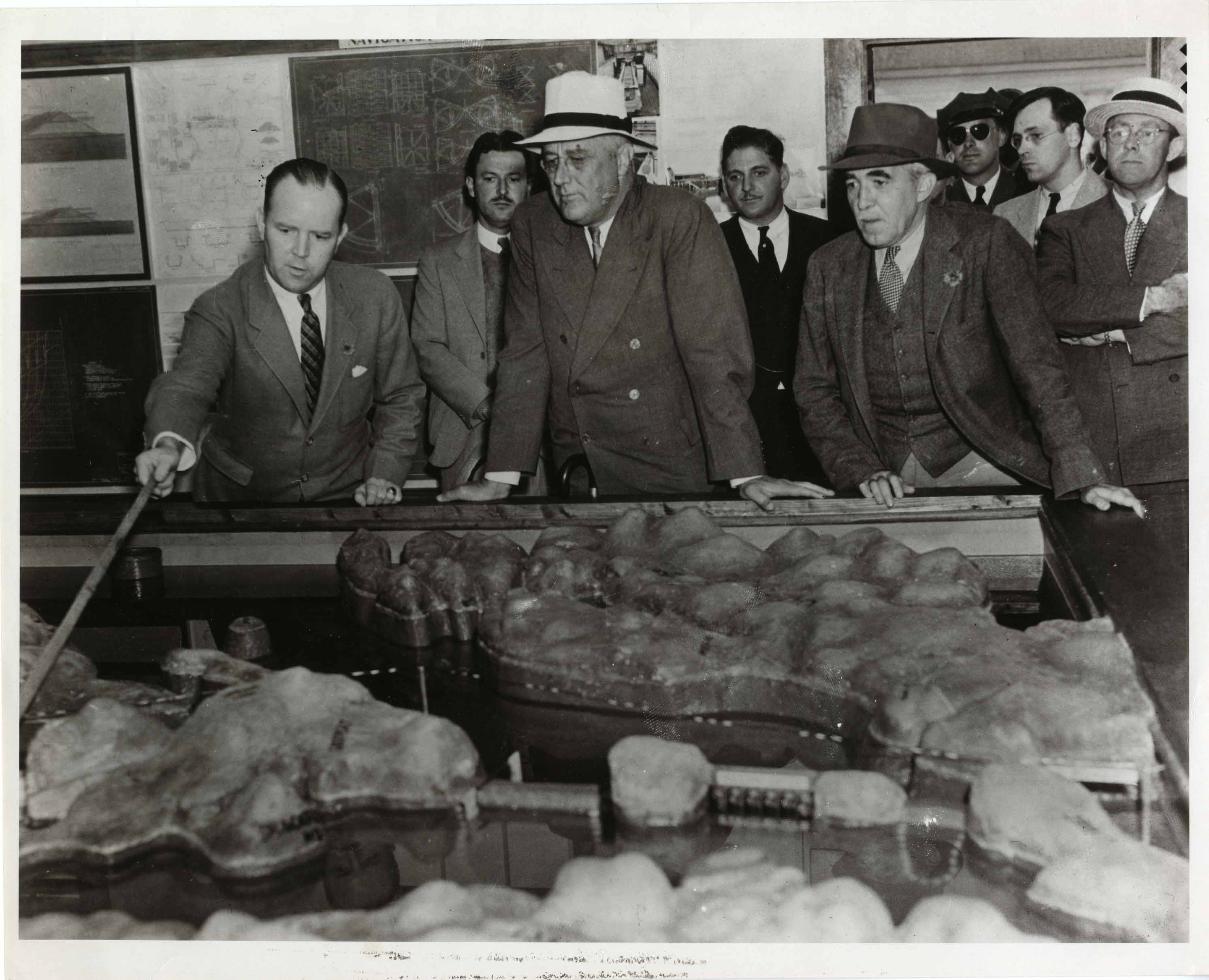 Caption: President Franklin Roosevelt examines a model of the proposed Quoddy Dam, Eastport, Maine in 1935. The project barely got off the ground before it failed miserably., Credit: National Archive. 