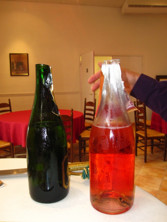 Caption: Champagne Bottles Post-Sabrage, Credit: Jane Alexander