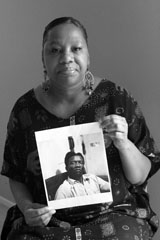 Caption: Bridgette McGee holds a photo of her grandfather, Credit: Teri Havens