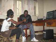 Caption: Esther Kalenga interviews her producer, Mundia Mundia