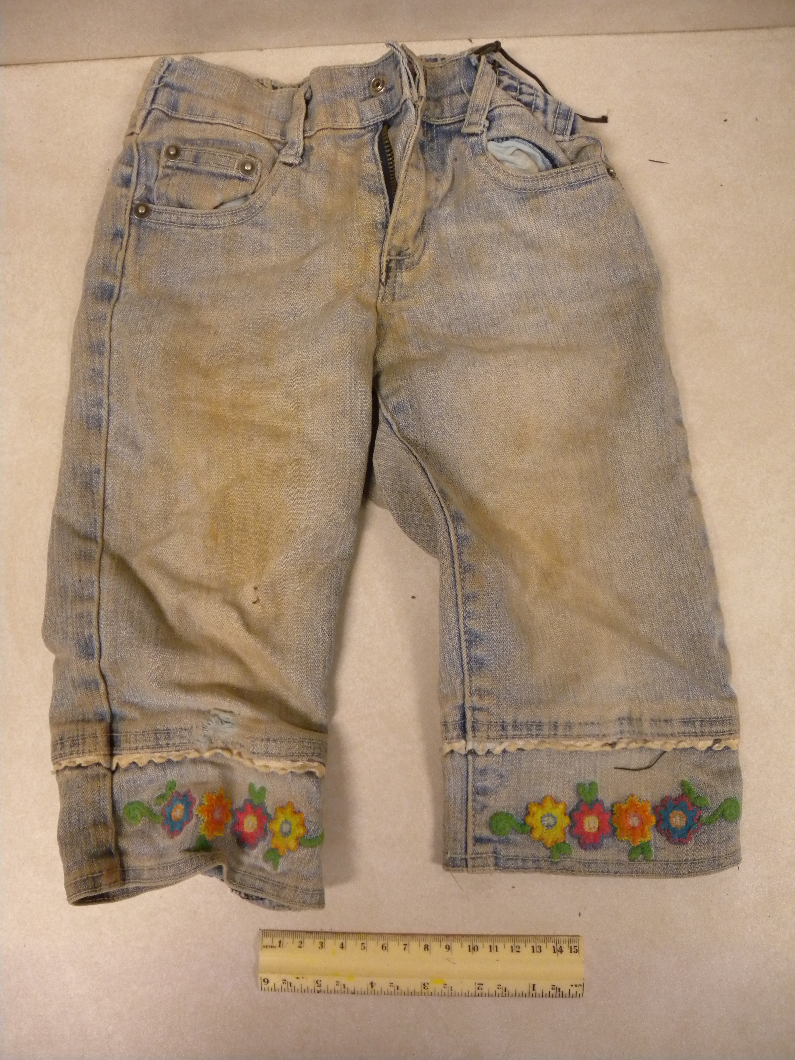 Caption: Soiled jeans worn by a young girl who attempted to cross the Sonoran desert with her family., Credit: Jason DeLeon 