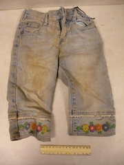 Caption: Soiled jeans worn by a young girl who attempted to cross the Sonoran desert with her family., Credit: Jason DeLeon 
