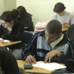 Caption: Students take a standardized test at a high school in Greensboro, North Carolina., Credit: Billy Barnes
