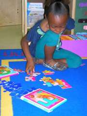 Caption: A student in a preschool classroom at River Breeze Elementary, a public school in Palatka, Florida. Preschool used to be a radical idea, but now the majority of American children go to preschool. , Credit: Stephen Smith