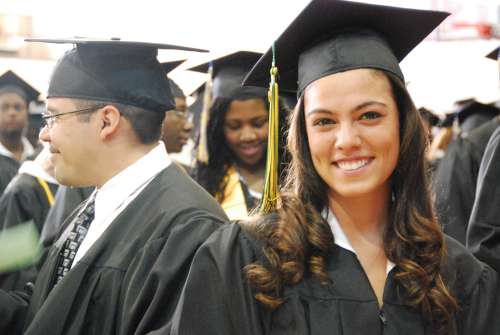 Caption: Students on their graduation day from Montgomery College, a community college in Maryland. Most young Latinos looking for a way up through higher education choose community college, but a lot of them never make it to graduation day. , Credit: Emily Hanford