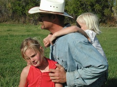 Caption: Glenn Elzinga and daughters, Credit: Guy Hand