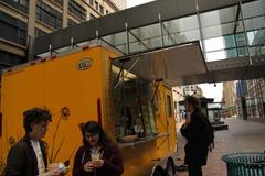 Caption: Workers from a nearby office grab a bite to go., Credit: Noel Clark
