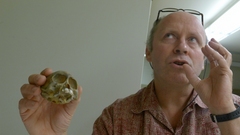 Caption: Bill Stanley and the skull of a new genus he helped identify.