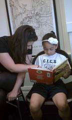 Caption: Open Books program director Anna Piepmeyer and second grader Jayla Mercado. , Credit: Niala Boodhoo