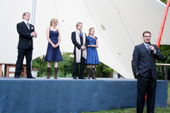 Caption: Alec Wild explains a scene at Chocolate, Shakespeare, and Champagne, Credit: KQAL