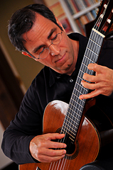 Caption: Charles Mokotoff spent years hiding his hearing loss, as he performed and taught classical guitar., Credit: Cathy Dyer