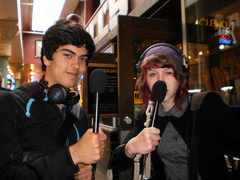 Caption: Kendrick and  Max gather audio at the Pike Place Market in Seattle, Credit: Sarah Dillard